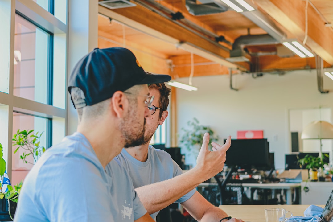 Two men working together in an office.